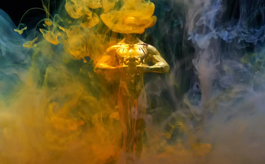 golden oscar statue, covered in fog